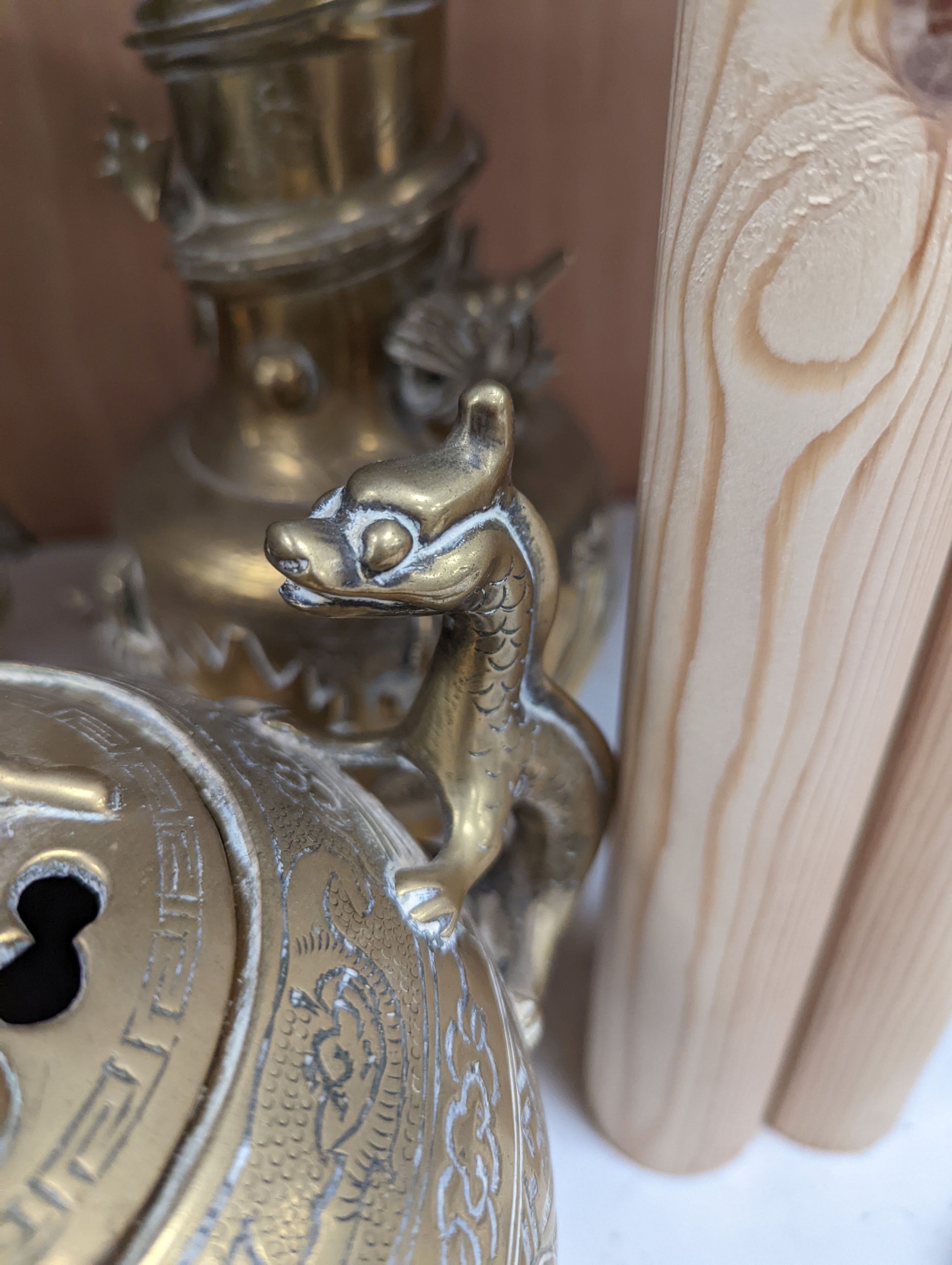 A pair of Chinese brass dragon vases, 26cm, together with two similar incense burners, tallest 30cm high